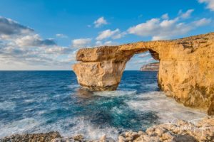 Azure Window natural arch featuring a table-like rock over the sea in the Maltese island of Gozo.