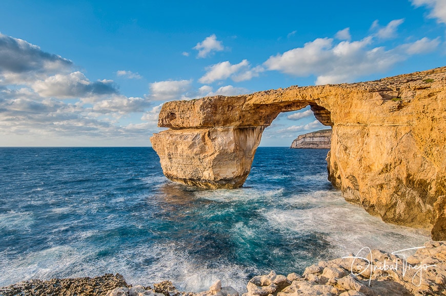 Azure Window natural arch featuring a table-like rock over the sea in the Maltese island of Gozo.